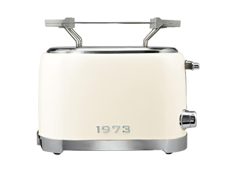 Crèmekleurige retro broodrooster met chromen details en het jaartal '1973' op de voorkant.