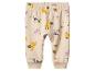 Lichtbruine babybroek met dierenprint zoals zebra's, giraffen en nijlpaarden.