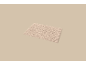 Beige badmat met een golvend patroon.