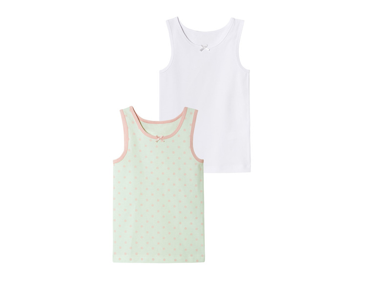 Twee meisjes tanktops, een wit en een met roze stippen