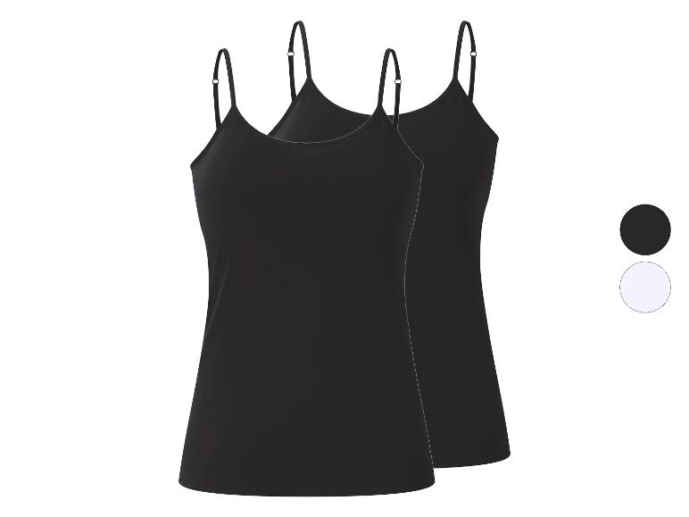 Twee zwarte hemdjes met dunne bandjes, met een zwart en wit kleurstaal.