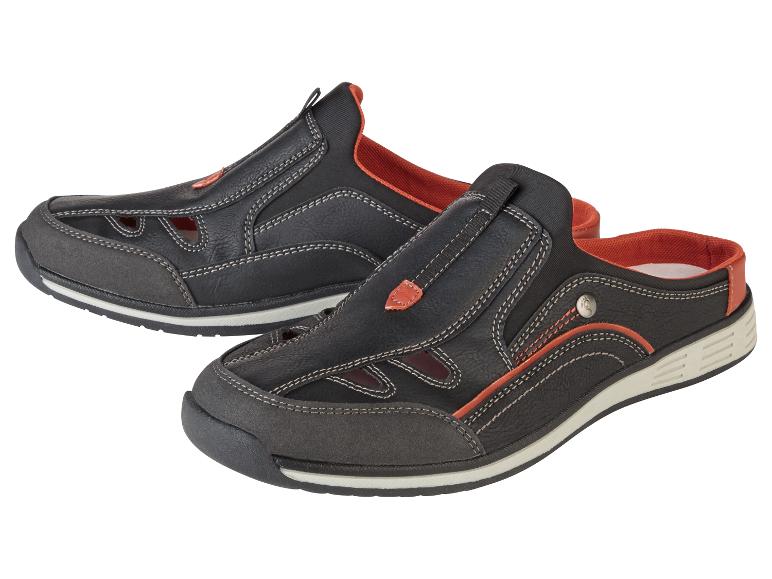 Zwarte open sandalen en mules met oranje details.