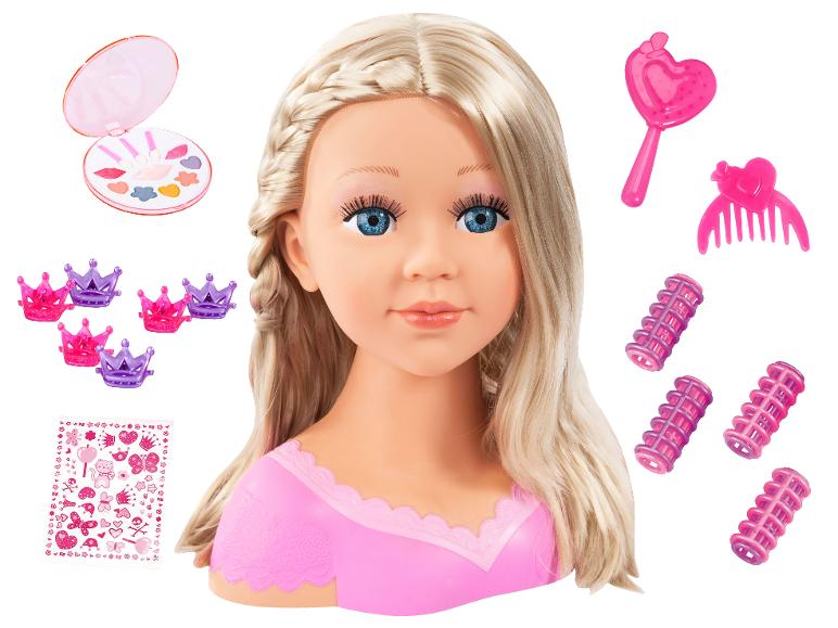 Blonde stylingkop met make-up, haarrollers, kroontjes en haaraccessoires