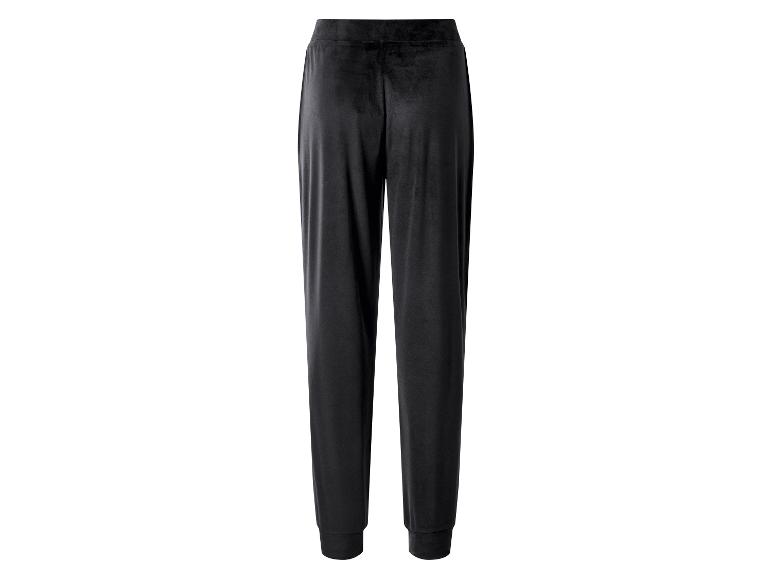 Zwarte fluwelen joggingbroek met elastische tailleband en boorden.