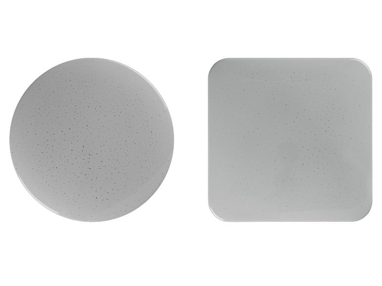 Twee grijze objecten, een rond en een vierkant, met kleine puntjes.