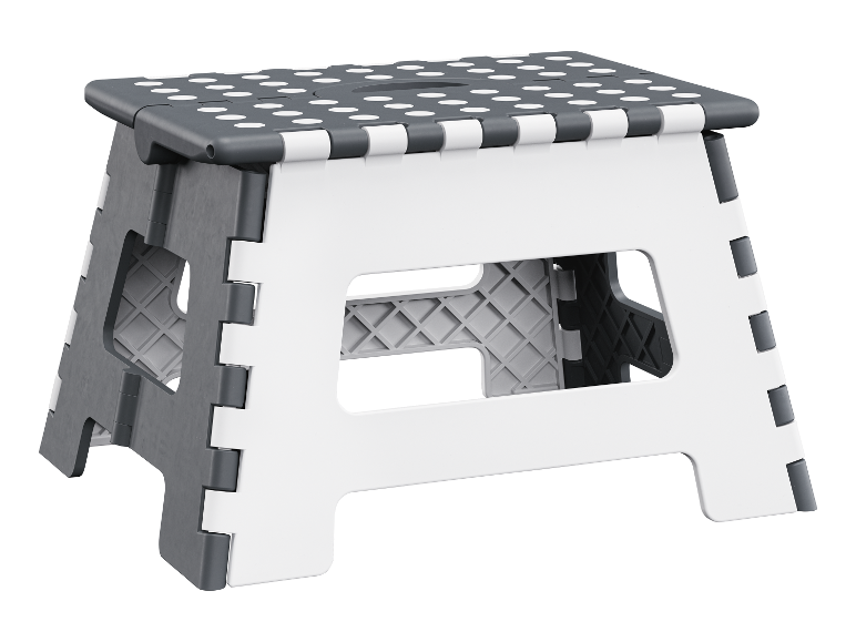 Een opvouwbare grijze en witte kruk met stippen.