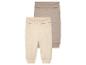 Twee baby leggings, beige en taupe, van zachte stof.