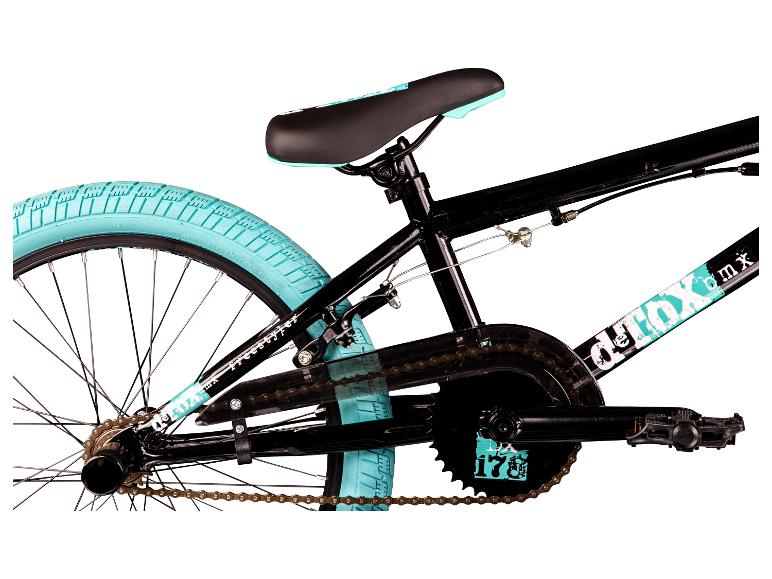 Zwarte BMX-fiets met turquoise banden en zadel.