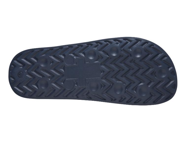 Onderkant van een donkerblauwe slipper met een gestructureerde zool.