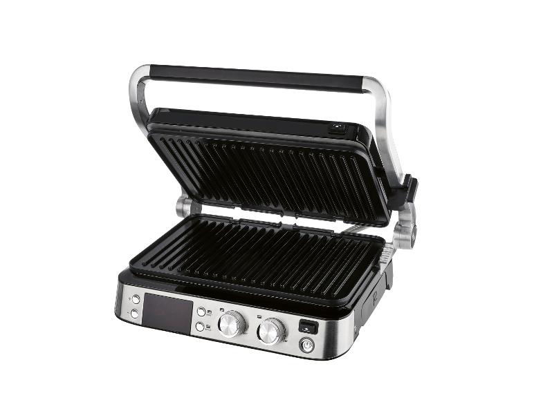 Open elektrische grill met zwarte geribbelde platen en zilveren bedieningspanelen.