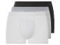 Drie boxershorts in wit, grijs en zwart.