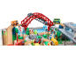 Houten treinset met rode brug, ambulance, bus en diverse verkeersborden.
