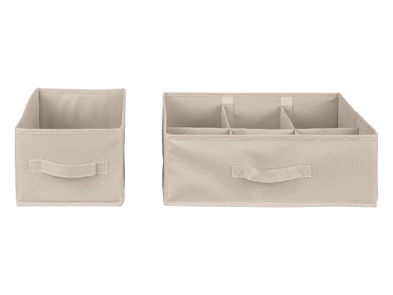 Twee beige opbergdozen, een met vakken voor kleding