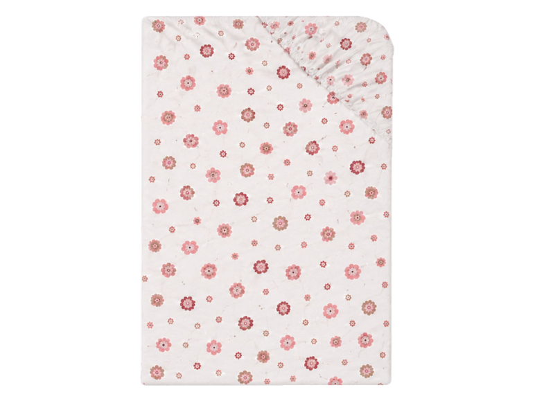 Jersey hoeslaken met roze en wit bloemenpatroon.