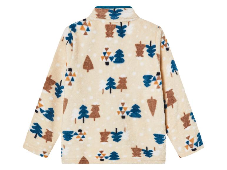 Een crèmekleurige fleecejas met een boomprint.