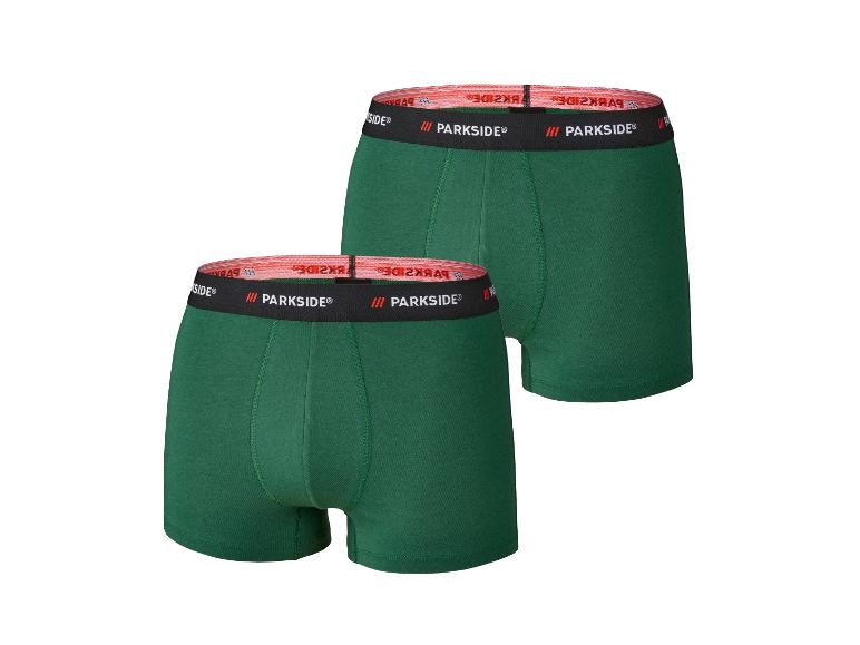 Twee groene Parkside boxershorts met een zwarte en rode tailleband.