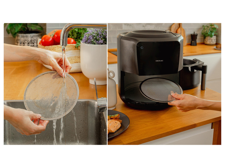 Een Cecotec airfryer met een rooster dat wordt schoongemaakt.