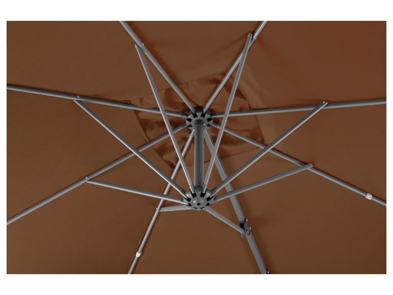 Bruine parasol van onderen gezien met zichtbaar frame