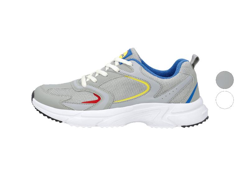 Grijze sportschoenen met blauwe, gele en rode accenten, en een witte zool.