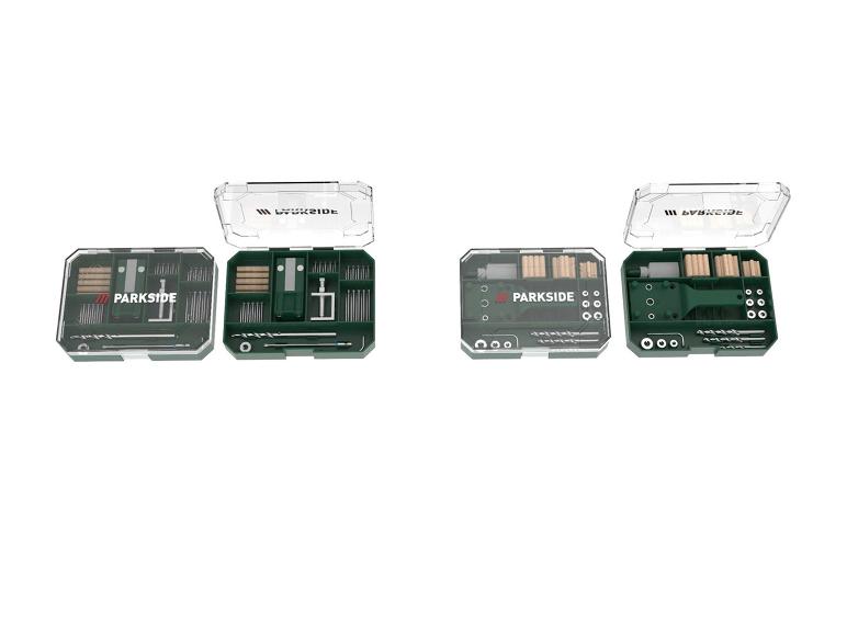 Twee groene gereedschapsets met boren, schroeven en andere accessoires.