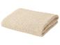 Gevouwen beige katoenen handdoek met een decoratief patroon