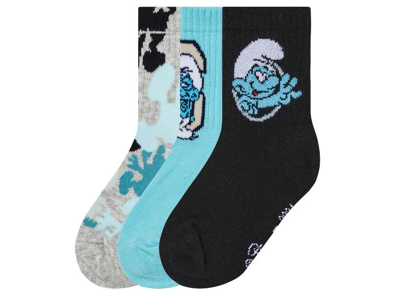 Drie paar sokken met Smurfen-motief.