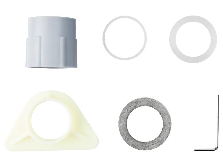 Reserveonderdelen voor een koffiemachine: plastic onderdelen, pakkingen en een gereedschap.