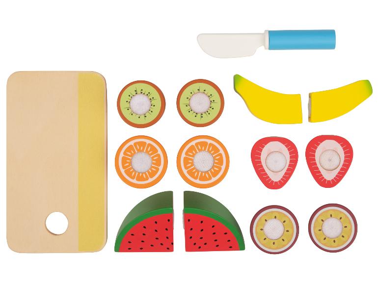 Houten speelgoedset met gesneden fruit en een snijplank