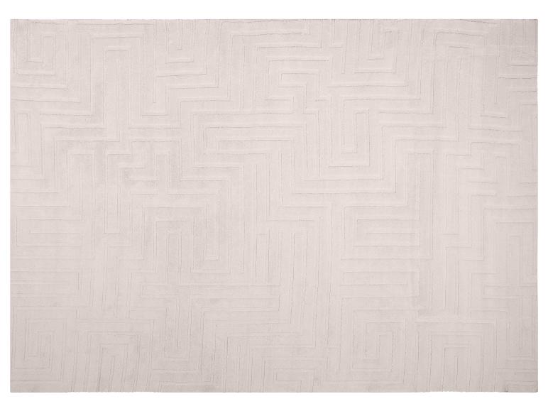 Lichtbeige vloerkleed met een geometrisch doolhofpatroon