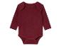 Een donkerrode baby romper met lange mouwen.