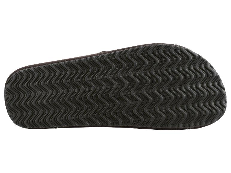 Onderkant van een donkergrijze pantoffelzool met een golvend patroon