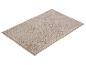 Beige badmat met pluizige textuur