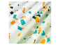 Witte stof met oranje, blauwe en groene stippen.