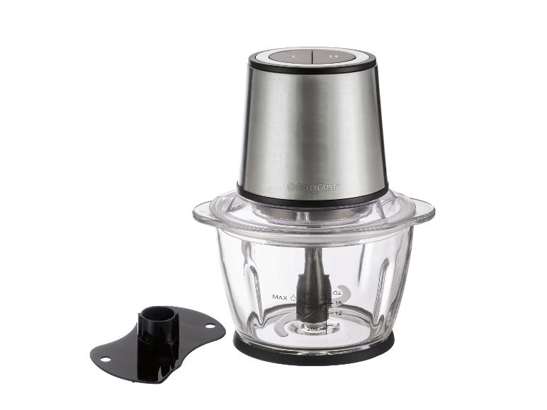Hakmolen met glazen kom en zilverkleurige motor, inclusief extra accessoire.