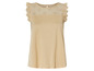 Beige top met ronde hals en kantdetails.