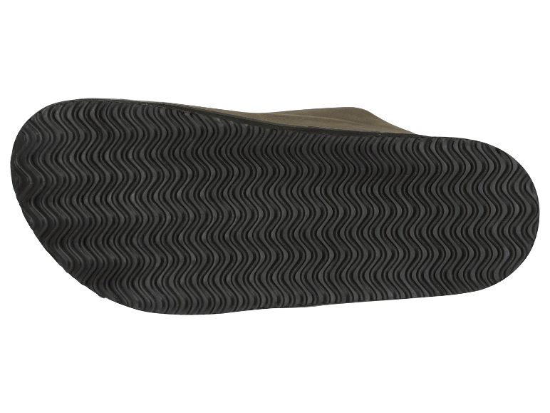 Een afbeelding van de zool van een schoen met een golvend patroon.