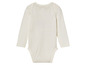 Witte baby romper met lange mouwen.