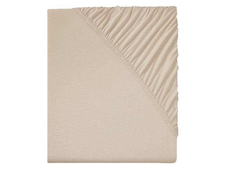 Beige effen hoeslaken.