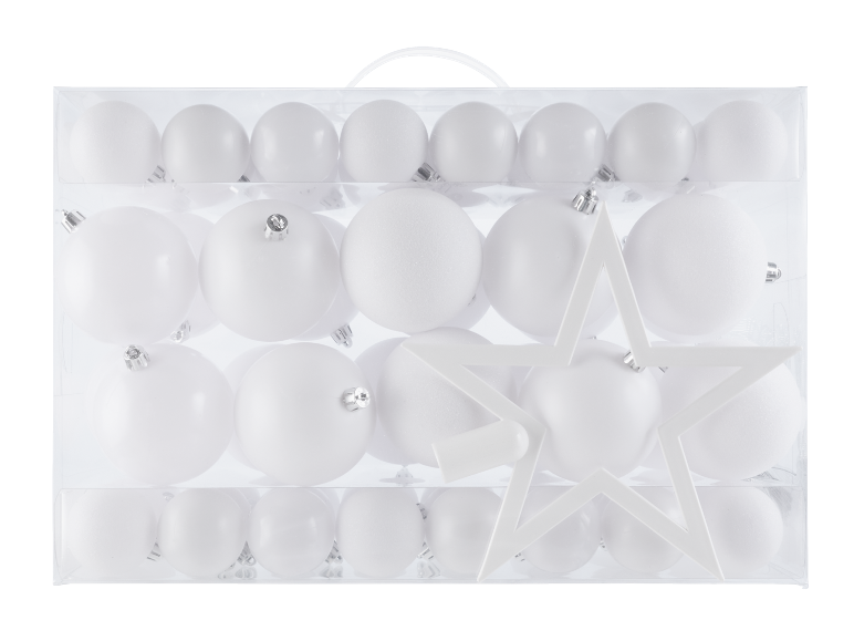 Doos met witte kerstversieringen, inclusief ballen en een ster.