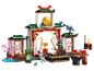 LEGO Ninjago set met tempel, gong, minifiguren en trainingsaccessoires.