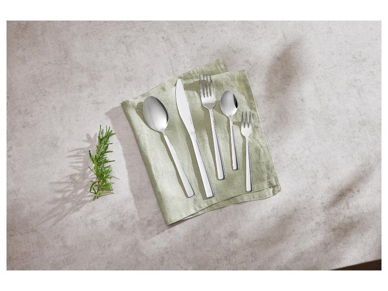 Demeyere bestek: lepels, vorken en mes op een theedoek.