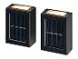 Twee zwarte op zonne-energie werkende LED-lampjes worden getoond.