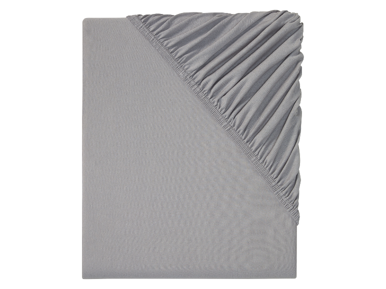 Grijs hoeslaken en vlak laken: eenvoudige en comfortabele beddengoed.
