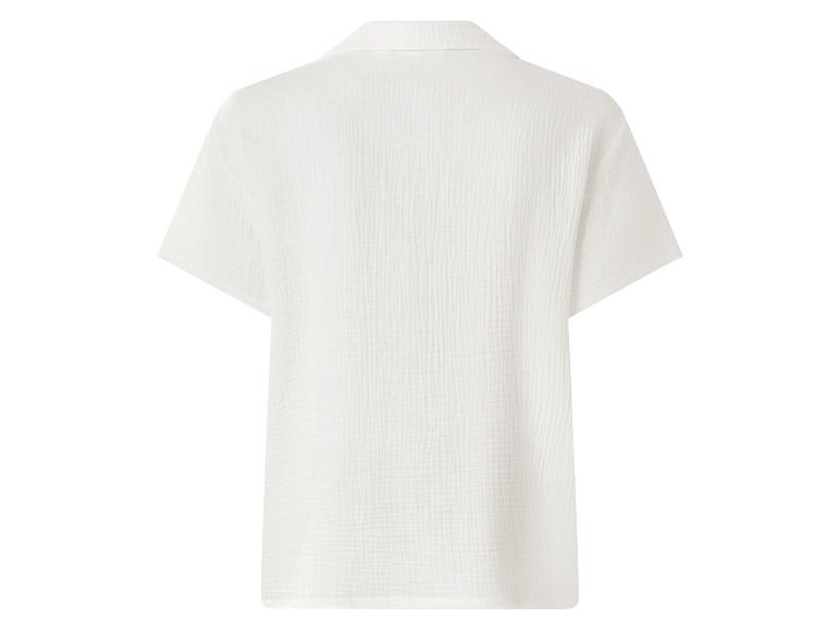 Witte mousseline damesblouse met korte mouwen, achterkant.