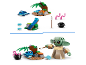 Twee Lego sets: een baby-alienfiguur en een eiland met een kampvuur en een kikker.