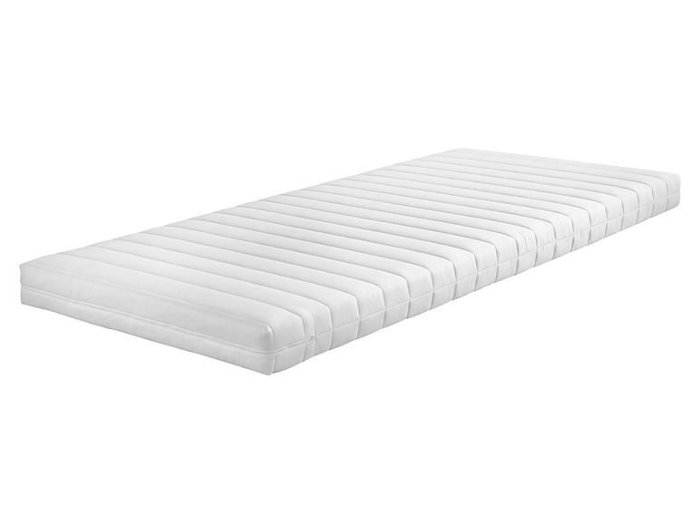 Een wit matras met een gestreept ontwerp.