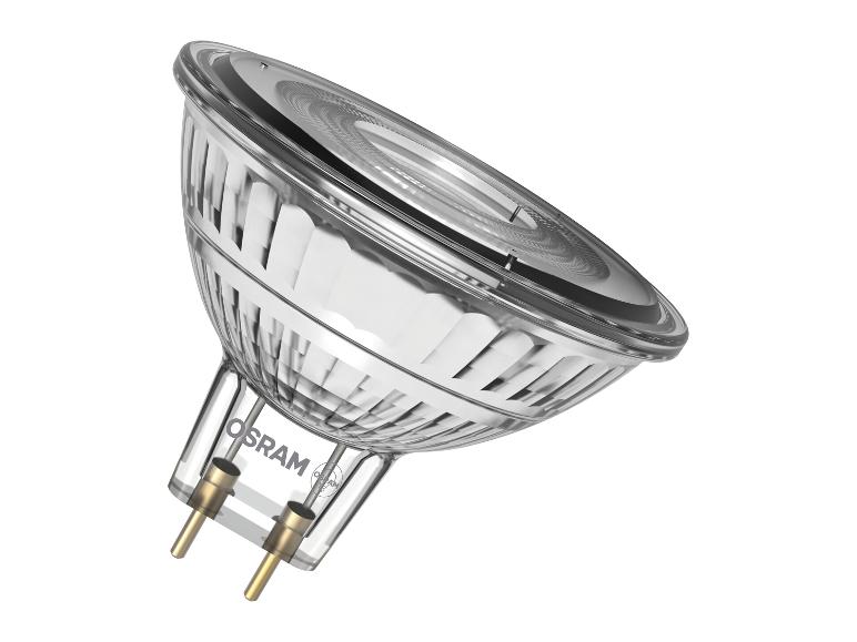 Glazen halogeenlamp met twee pinnen en een geribbeld oppervlak, schuin geplaatst.