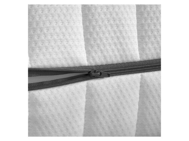 Detail van witte matrashoes met rits.