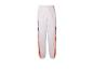 Witte trainingsbroek met oranje en zwarte details.