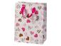 Witte cadeauzak met roze en bruin hartenpatroon, met roze linten handvat.